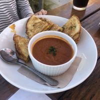 Grilled cheese and tomato soup with root beer Olipop  at Seabirds Kitchen - The LAB in Costa Mesa