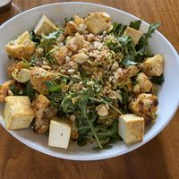 Warm Cauliflower salad with the tahini on the side and no chiles. Yummy!!! at Seabirds Kitchen - The LAB in Costa Mesa