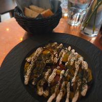 Fried aubergine and tomato with vegan garlic sauce and foccaccia at Bread and Wine in Tromsoe