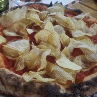 I asked for a red pizza with fried chips. Was really good, especially the pizza dough! at Fossi Bar & Cucina in Otranto