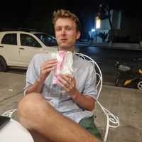 Hubby enjoying his bag of chocolate at Repapis - Ζαχαροπλαστείο in Leros