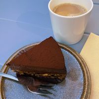 Chocolate pie and coffee with oat milk  at Aroma in Vaasa