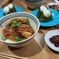 Katsudon and onigiri. The little dish on the side is sweet potato-based and came with the katsudon. Two katsudon and two orders of onigiri was a huge amount for two people to eat. at Hachidori Table - ハチドリTable in Kyoto