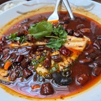 Sliced "fish" in chili oil at Tofu Vegan - Charlotte in London