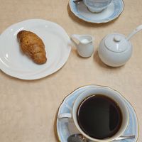 Coffee with soy cream and salty croissant-style viennoiserie at MERCY Vegan Factory - Kyoto Station in Kyoto
