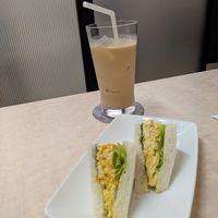Half an egg sandwich with a milk tea at MERCY Vegan Factory - Kyoto Station in Kyoto