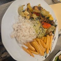 Grilled vegetables (eggplant, zucchini, peppers, mushrooms) with fried potatoes and jasmine rice at Sirály Étterem in Visegrad