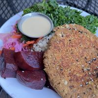 Buddha Bowl (GF) – oil-free option without the dressing: lentil burger patty steamed on the grill, coconut brown rice, steamed kale, chilled beets, pickled carrots & cabbage.   at The Red Fern in Rochester