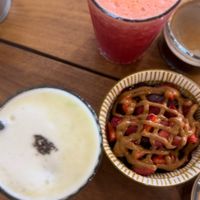 Mini Açaí bowl with peanut butter and local strawberries / Pineapple-Green Apple-Mint-Juice / Orange-Carrot-Beet-Ginger-Juice at Bainema in Angra Do Heroismo