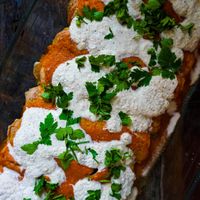 Alkaline enchiladas with housemade brazilian nut cheese & heirloom tomato sauce at Alkaline Valley - Order & Pick-Up in Amsterdam