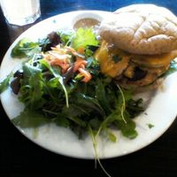 ORGANIC CHICKEN BURGER with baby greens side salad. at Green Corner Cafe in Glendale
