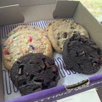 Double chocolate chip (front), birthday cake (left), and chocolate chip (right). 😋  at Insomnia Cookies in Bloomington