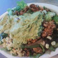 Sofritas Salad (sofritas spicy tofu, corn, peppers, onion, lettuce, brown rice, black beans, and guacamole.) at Chipotle - Strada Pl in Naples