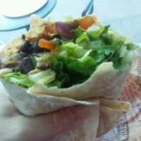 Veggie burrito (beans, rice, peppers, onions, corn, lettuce, guacamole) at Chipotle - Strada Pl in Naples