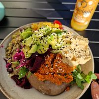 Kumpir vegano, topped with masses of avocado, hummus, and all sorts of salad at Kumpir Club Fresh Food & Coffee in Berlin