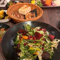 Beautiful salad accompanied by yummy appetisers! at Cappadocia in Bristol