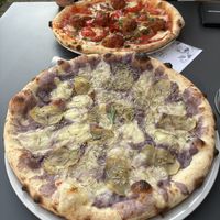Vegan Violetta pizza made with truffled potatoes, and the nonna pizza with vegan meatballs  at VyA in Luzern