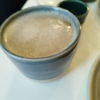 Black tea with oat milk at Bistro Deppat in Vienna