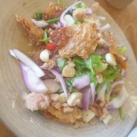 Fried vegan egg spicy salad - 7/10 it's nice but hard to eat cuz of just sm raw onion garlic and chilli which I'm not an expert at devouring, if this was a small starters 👍 at Kem-Kon KhaoSan (เข้ม-ข้น ข้าวสาร) in Bangkok