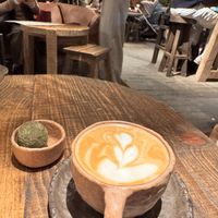 Macha protein ball and almond cappuccino   at Honest Greens in Valencia