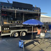 Food truck parked behind a paint store   at Elubia's Kitchen - Santa Barbara Cider Location in Goleta in Goleta