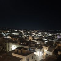 View over Naxos at night at Avaton 1739 - Coffee & Wine Roof in Naxos