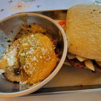 Sausage and onion panini and potatoes au gratin at The Kitchen at Farm Sanctuary in Watkins Glen