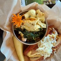 The dog with ravioli salad on the side at The Kitchen at Farm Sanctuary in Watkins Glen