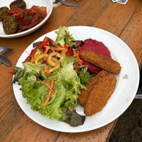 Vegan Nuggets with red hummus and salad. Vegan Quinoa Fritters with Ratatouille    at Biergarten Waldheim in Munich