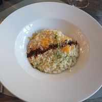 Veganes Risotto mit Zitrusfrüchten, Prosecco und Lakritzpulver at Caesar's Restaurant & Lounge in Brissago