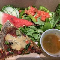 Vegan pizza with fresh salad to go 8 ) at Lettuce Inn in Concord