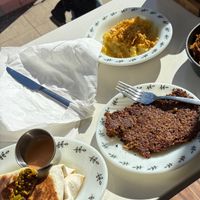 Breakfast burrito with Grippo’s aioli (lower left), side of goetta (lower right), and party potatoes (top). All of the food items were incredible. at juniper seed in Cincinnati