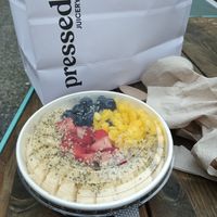 Vanilla bowl with sliced bananas, strawberries, blueberries, chopped mango, and hemp hearts. at Pressed Juicery in Philadelphia