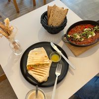 Brunch burrito, latte, and shakshuka. at Prince Peach in Berlin