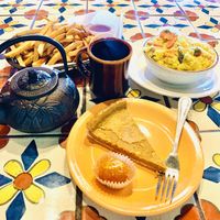 kitchari, masala fries, ladu, cheesecake, tea at Annapurna's World Vegetarian Cafe in Santa Fe