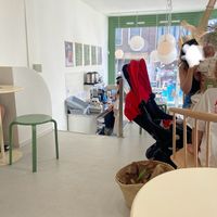 Seating upstairs: a small space and crammed. There are only 3 small tables and a larger table. The toilet is downstairs. at Tea Stories in Amsterdam