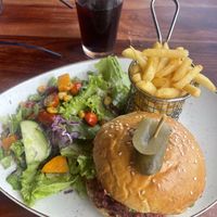 Burger with a salad and chips  at The Lookout Cafe in Victoria Falls