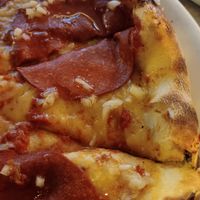 Vegan cheese and pepperoni on pizza at Vapiano - Wien Mitte in Vienna