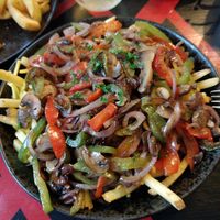 Loaded fries were amazing - get the chimichurri topping, it's delicious! at Hatters in Sark