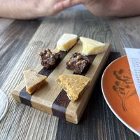 Pumpkin + sesame seed brittle; lemon/citrus candy (middle chocolate one was NOT vegan but was for my bf)   at Wren in Suttons Bay
