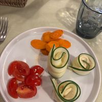 Stuffed cucumber starter with cream cheese, carrots and tomatoes at La Lanterna in Verona