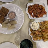 Pistachio crusted tofu, baked potatoes, and caponata at La Lanterna in Verona