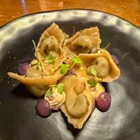 Pumpkin gnocchi 100% with fresh black truffle, vegan ricotta, sweet and sour onion, chestnuts and chamomile  at Bistro Esencia in Mallorca