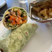 Vegan hummus and veggie wrap with chips. Everything is very fresh and quickly prepared    at Coco + Hazel in Richmond