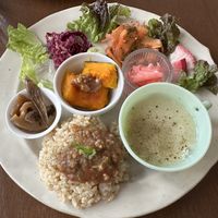 Lunch plate - cabbage with sesame seeds, carrot in basil sauce, pickled daikon, radish slices, potato soup, rice with soy based meat sauce, squash with peanut butter   at à petits pas in Sapporo