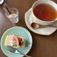 Dessert set- Black tea with brown sugar, rice flour almond cake with tofu cream, blood orange sauce, toasted almondd  at à petits pas in Sapporo