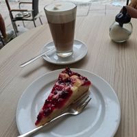 Vegan raspberry cake and Latte Machiatto with Oat Milk at Caffè Lucca in Fuessen