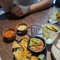 Guac and chips with two free dips (one spicy and one sour cream) at Kitade Tacos & Sake - Chuo City in Tokyo