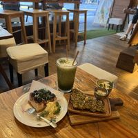 Matcha oat milk latte and pistachio plant based cake  at Bonsai Botanika in Brisbane