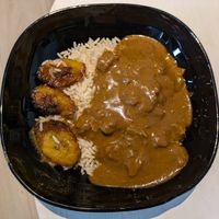 Maffé with rice and plantains at The Jollof Man - Food Stall in East London